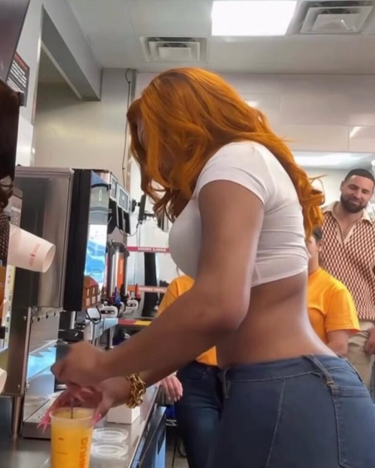 A photo of Klay Thompson in the back checking out his girlfriend Megan Thee Stallion as she makes a drink at Dunks is going viral
