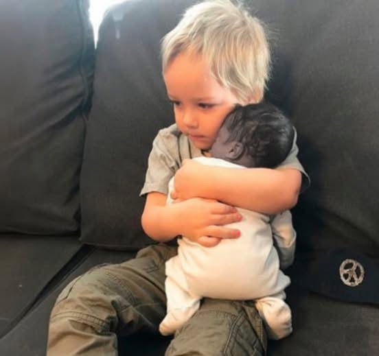 The stillborn baby was placed in his old…