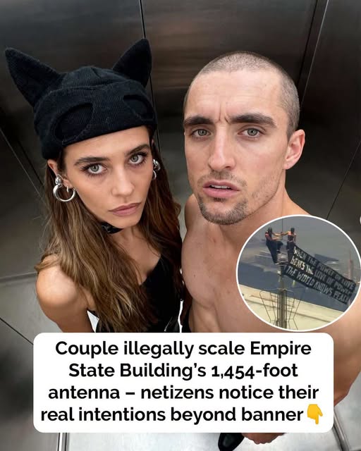 Couple scales Empire State Building – people question true intentions